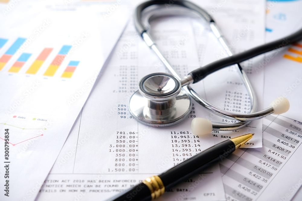 Stethoscope with Pen, Charts and Graphs, Finance, Account, Statistics, Investment, Analytic Research Data Economy Spreadsheet and Business Company Concept